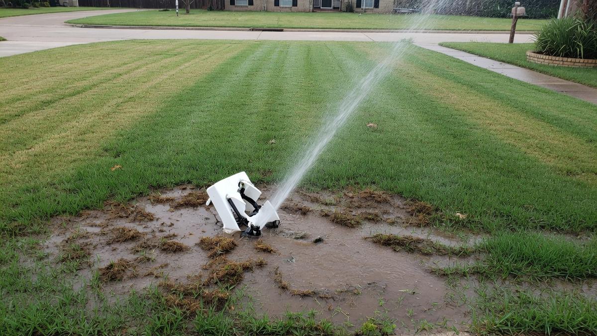 broken sprinkler heads on Tomball clay and Bermuda